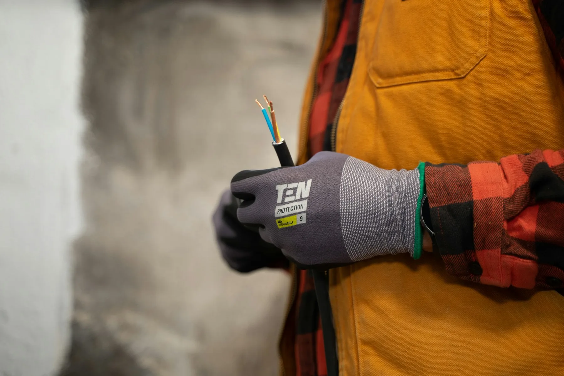Electrician connecting wires during a service visit.